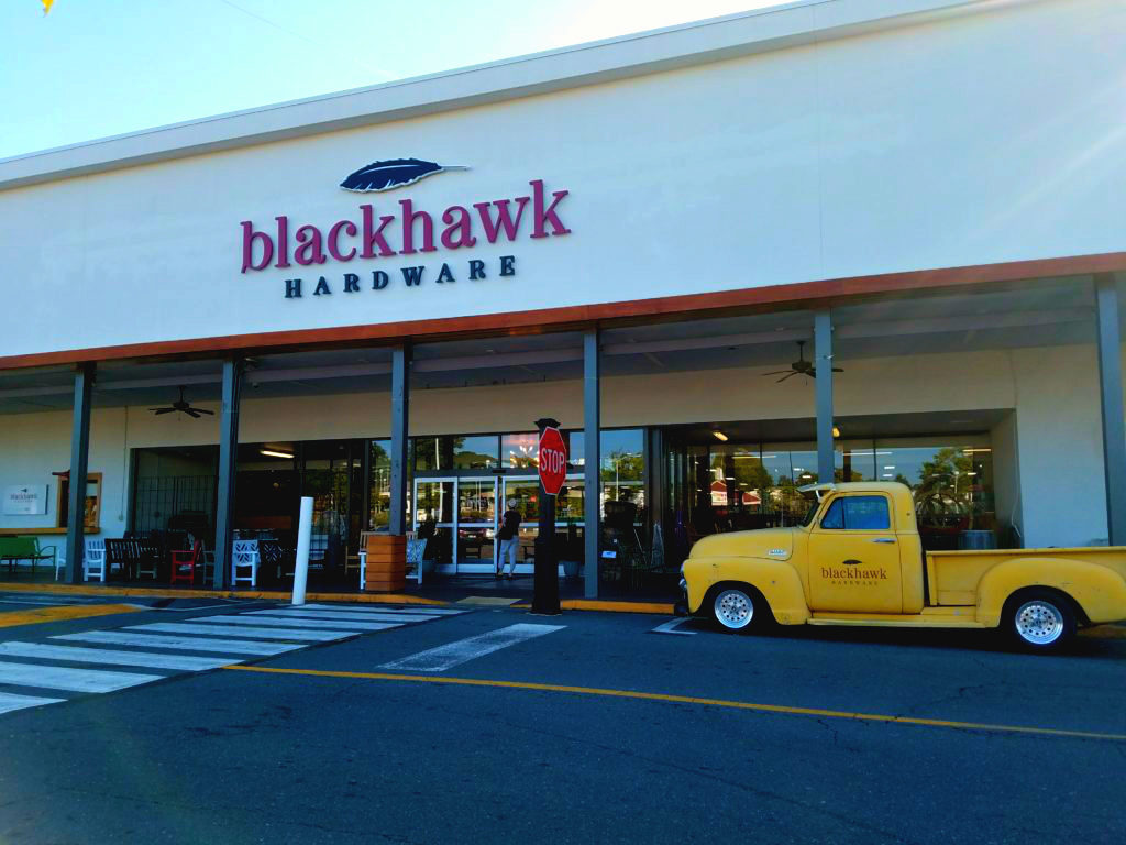 Classic pick-up truck parked in front of Blackhawk Hardware in iconic Park Road Shopping Center.
