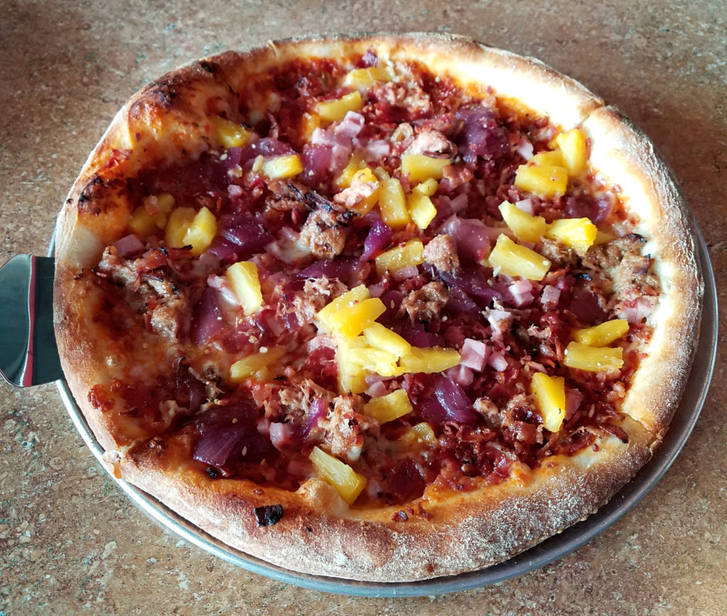 Hawaiian pizza on hand tossed crust. Ham, pulled pork, bbq, bacon, pineapple bbq sauce. yum.